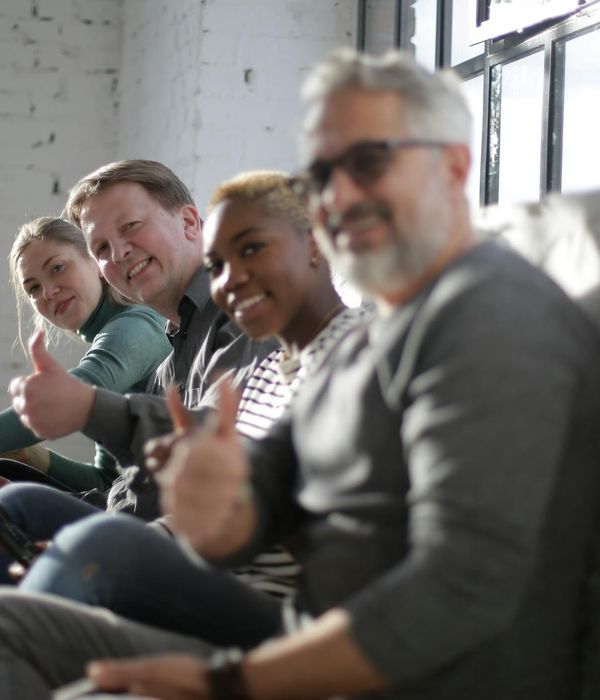 Diverse group of people of different ages enjoying a light cardio class together.